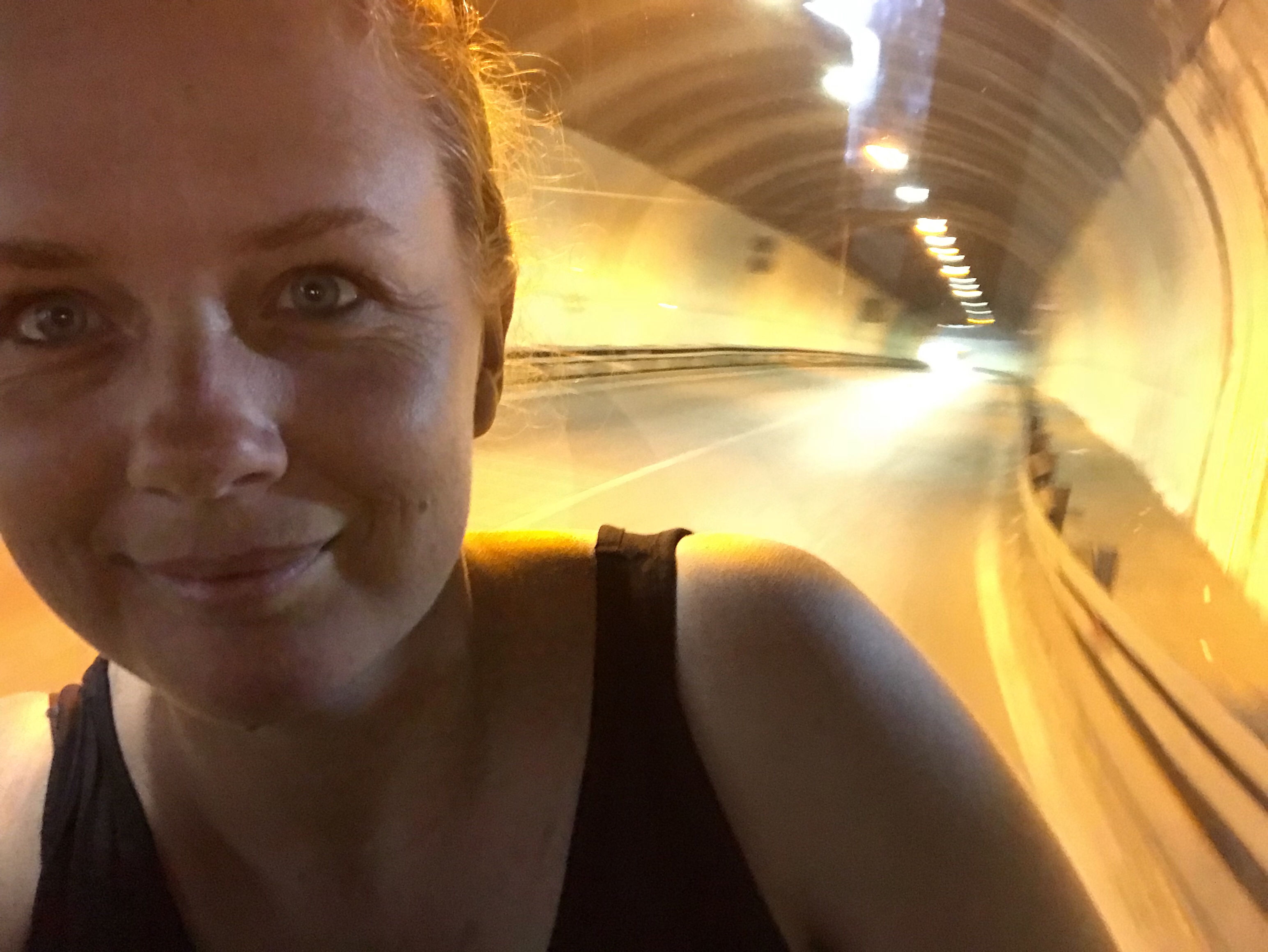 Going through a tunnel backwards in a bus.